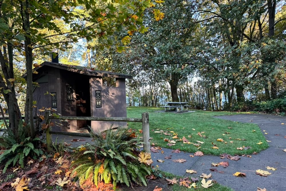 Bathrooms located by the picnic table area.