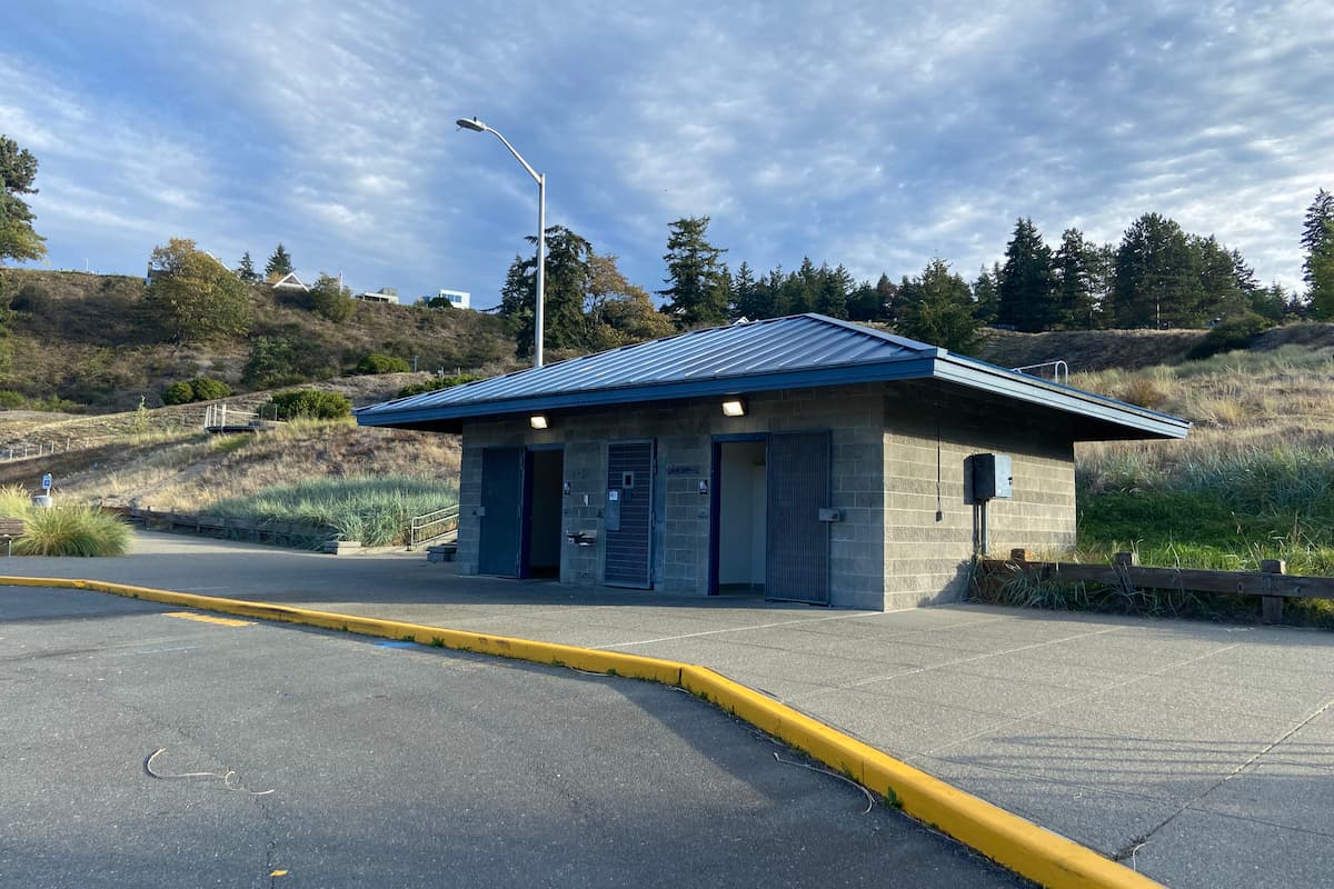 Public restrooms located in the parking lot nearest to the beach area.